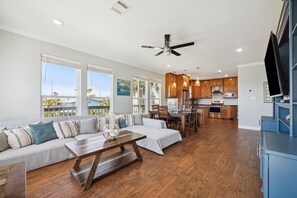 The home has an open floor plan that allow guests to commingle all on a single floor.guests in the living area.