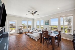 All windows have retractable blinds and the front door leads from the living area to the spacious wrap-around deck.