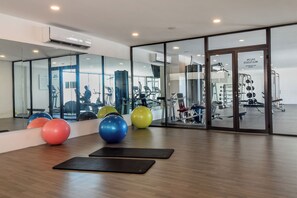 Stay active and refreshed in our shared gym space, featuring an abundance of workout equipment!