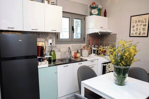 Kitchen in separate room with dining area