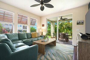 The living area has a plush sectional sofa, a perfect spot to Gather and have a fun family time.