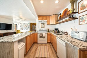 The kitchen has everything you need!Baking essentials, coffee maker, french press, toaster + more. 