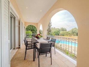 "Enjoy alfresco dining with friends and family on our spacious veranda, offering a picturesque setting for memorable moments."