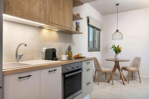 "Designed for your convenience – prepare meals or enjoy a quiet breakfast in this stylishly functional kitchen."