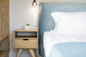 "Relax and unwind in the comfort of our Sea View Suite, featuring a sophisticated interior, a private balcony with mesmerizing views, and thoughtfully curated details for an unforgettable stay."
