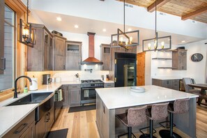 The fully equipped kitchen features high end appliances & everything you need to create memorable meals.