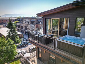 Relax and take in the downtown views from your private hot tub.