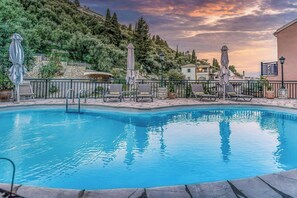 "The shared pool offers stunning views of the surrounding greenery, creating a peaceful retreat."