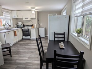 Kitchen also includes a laundry washer and dryer.