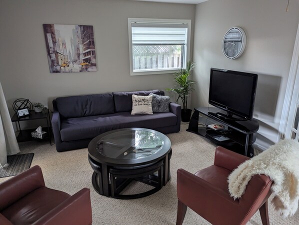 Living room with big screen TV includes Netflix and unlimited Internet.