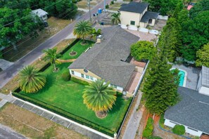 Spacious and lush, this backyard is perfect for relaxation and outdoor activities.