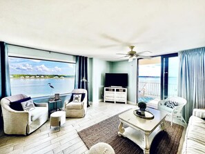 Spacious living room with ample seating and gorgeous panoramic water views!