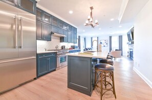 Modern kitchen with high-end appliances, a large island, and an open layout perfect for cooking and entertaining.