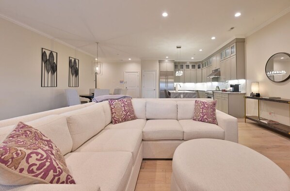 Elegant and spacious living room with cozy seating and contemporary decor. Perfect for relaxing evenings.