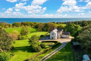 Set within extensive private gardens and overlooks the Solway Firth
