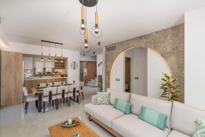 Open plan fully equipped kitchen - living area with direct access to the pool.