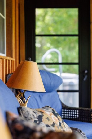 Breathe in the beauty of the South Fork Shenandoah River from our air-conditioned, screened-in sun porch. With ceiling fans and ample seating, it's the perfect spot for morning coffee or remote work, surrounded by stunning views.