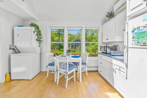 Your private kitchenette with a Keurig & K-cups, fridge, microwave, toaster, all the dish ware and utensils you'd need, lots of natural light, and seating for 3 at the dining table.