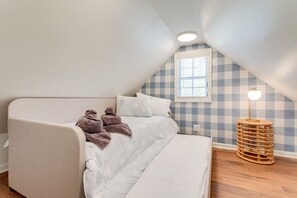 Upstairs loft space has two single beds.