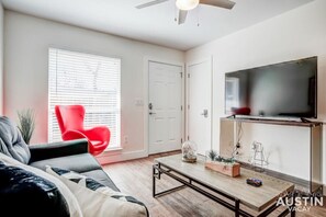 Living room with sleeper sofa and smart TV