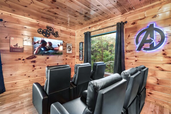 Gather around for a movie night in our cozy theater with seating for six.