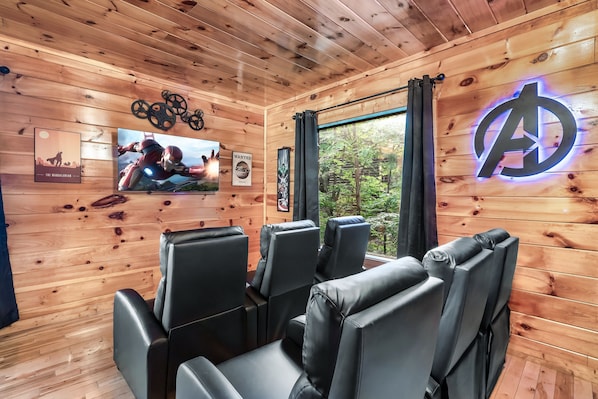 Gather around for a movie night in our cozy theater with seating for six.