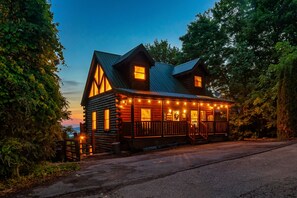 A peaceful sunrise view from the front of the cabin.