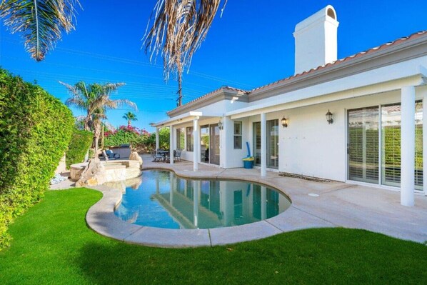 Spacious and private backyard with heated pool, hot tub, and BBQ
