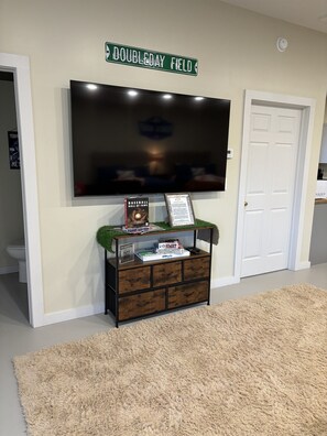 Smart TV with game cabinet below