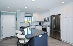 Kitchen - Updated kitchen with stainless steel appliances and granite countertops.