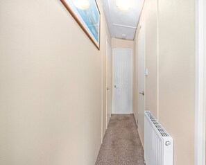 Bright and welcoming hallway, leading you to your cozy bedrooms!