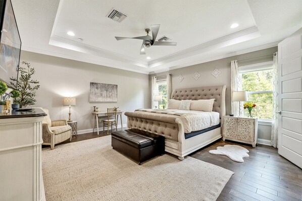Nestled in this inviting space is a comfortable queen-size bed, adorned with soft linens and plush pillows that promise a restful night's sleep.
