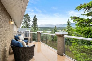 Private patio space off the primary bedroom with mountain views