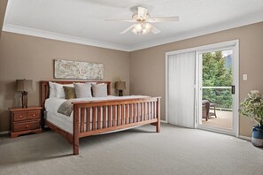 Primary bedroom upstairs with a King bed, pullout couch, cable TV, private ensuite full bathoom & balcony.