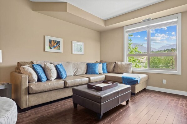 Living room with cable TV & mountain views