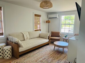 Comfortable Living area with AC and smart TV