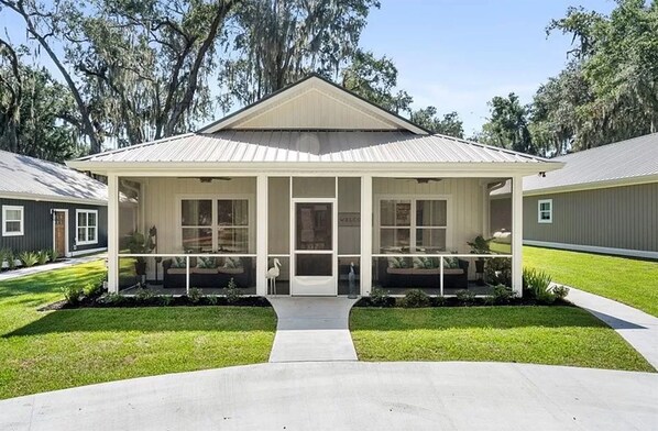 The circle drive is in front of the exterior of the home.
