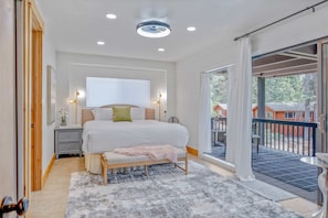 Bedroom 3: Master suite, king bed, en-suite bath, electric fireplace, small TV, access to patio, ground floor