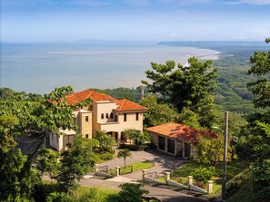 A picturesque front view, with a peaceful atmosphere and stunning landscaping.