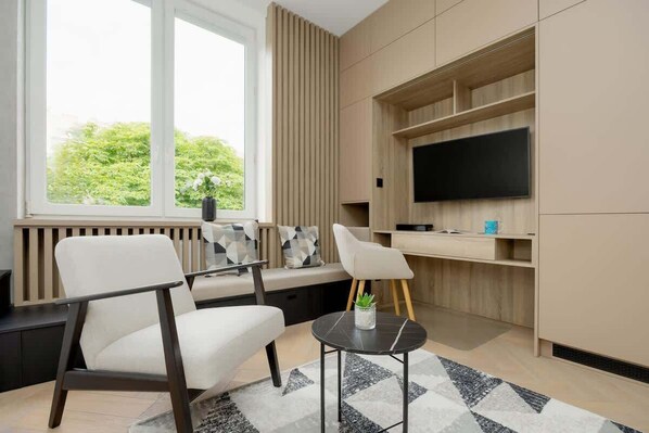 SmartTV, desk, armchair, coffee table, TV, remote working, lockers, WiFi, bed, bed linen, washing machine, iron
