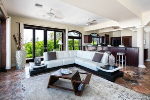 Modern living area with the kitchen in the background. 