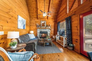 Cozy up by the fireplace in our cabin
