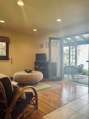 Living room with double doors that open to the lanai.