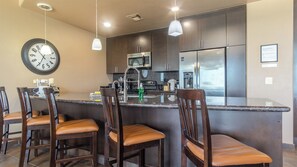 Additional seating at the kitchen bar counter top.