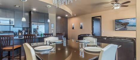 Enjoy the elegant raised dining table and custom lighting.