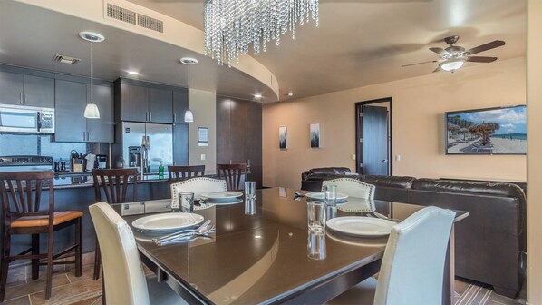 Enjoy the elegant raised dining table and custom lighting.