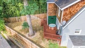 Where relaxation meets flavor: Our backyard oasis, complete with a bubbling hot tub and sizzling BBQ grill, is the perfect blend of unwind and dine.