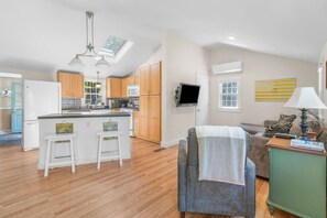 Adjacent kitchen and living areas for the family to gather & relax together.
