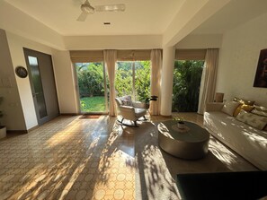 Natural light flooding the living room during the day.