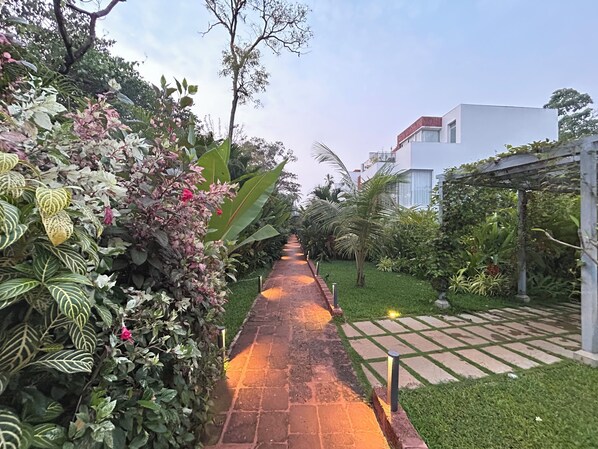 Earthy Pathway with stunning views on all sides leading upto the villa entrance